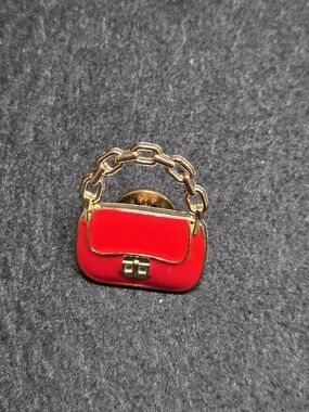 **Red Enamel Mini Handbag Pin with Gold Chain Accent**